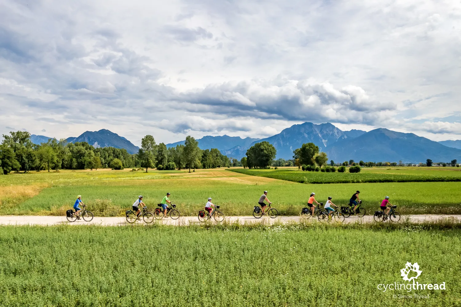 Alpe-Adria Bicycle Route with Alps in the background