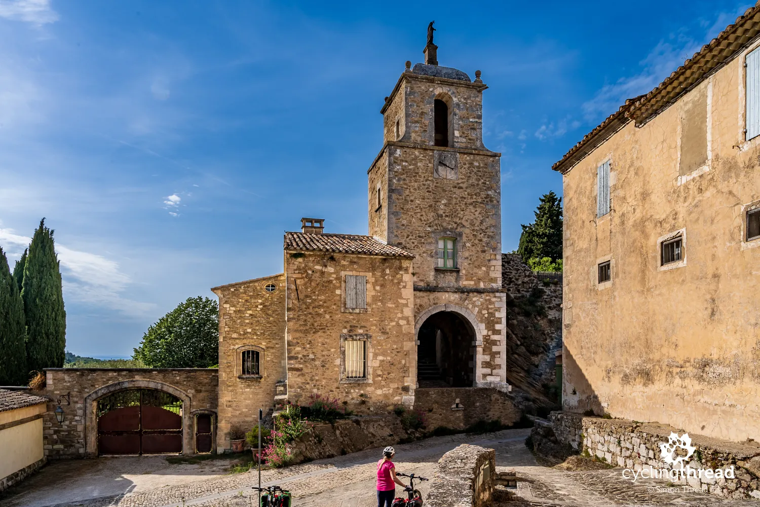The bell tower and gate in Maubec