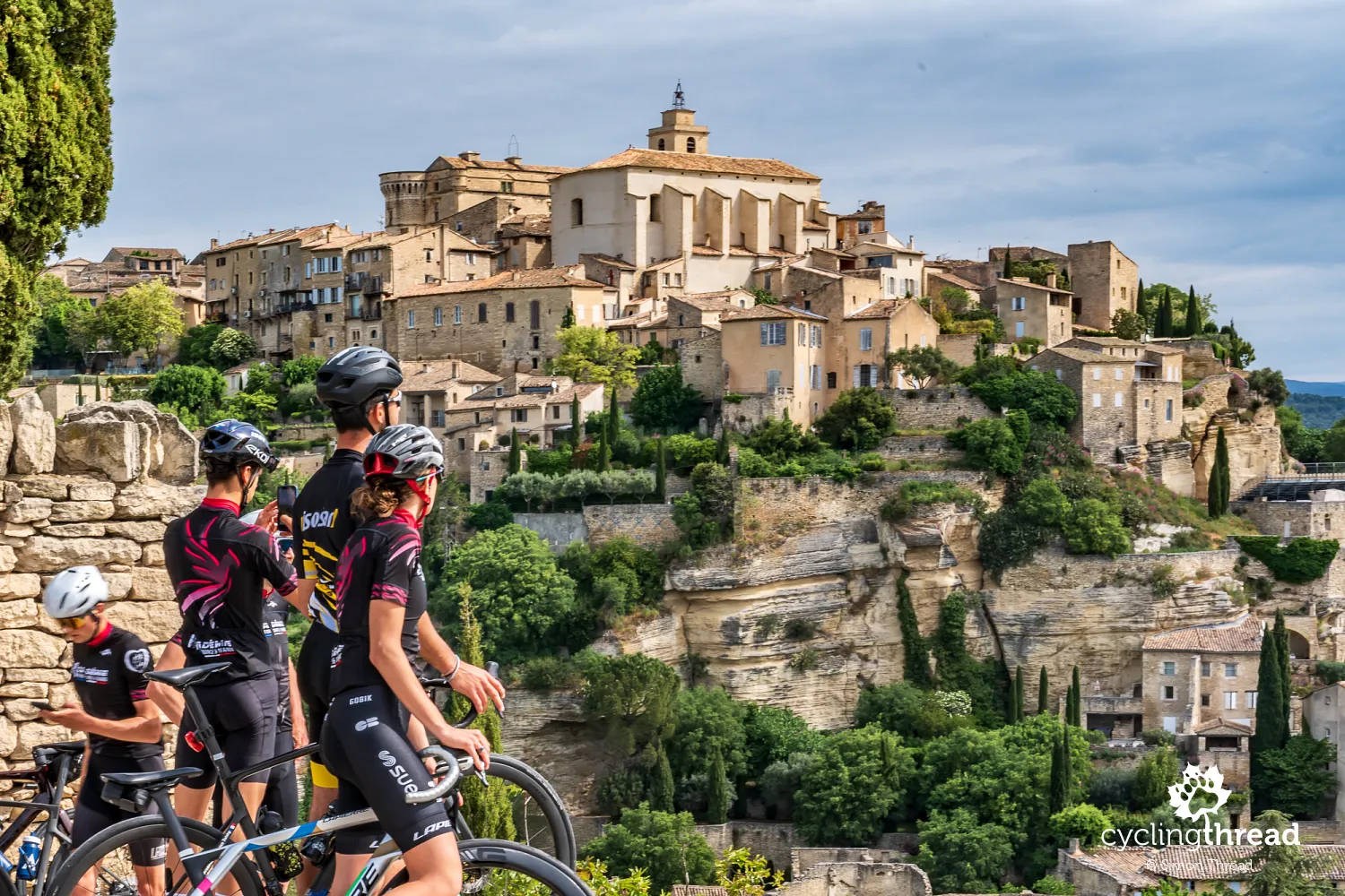 Cyclists enjoying the view of Gordes