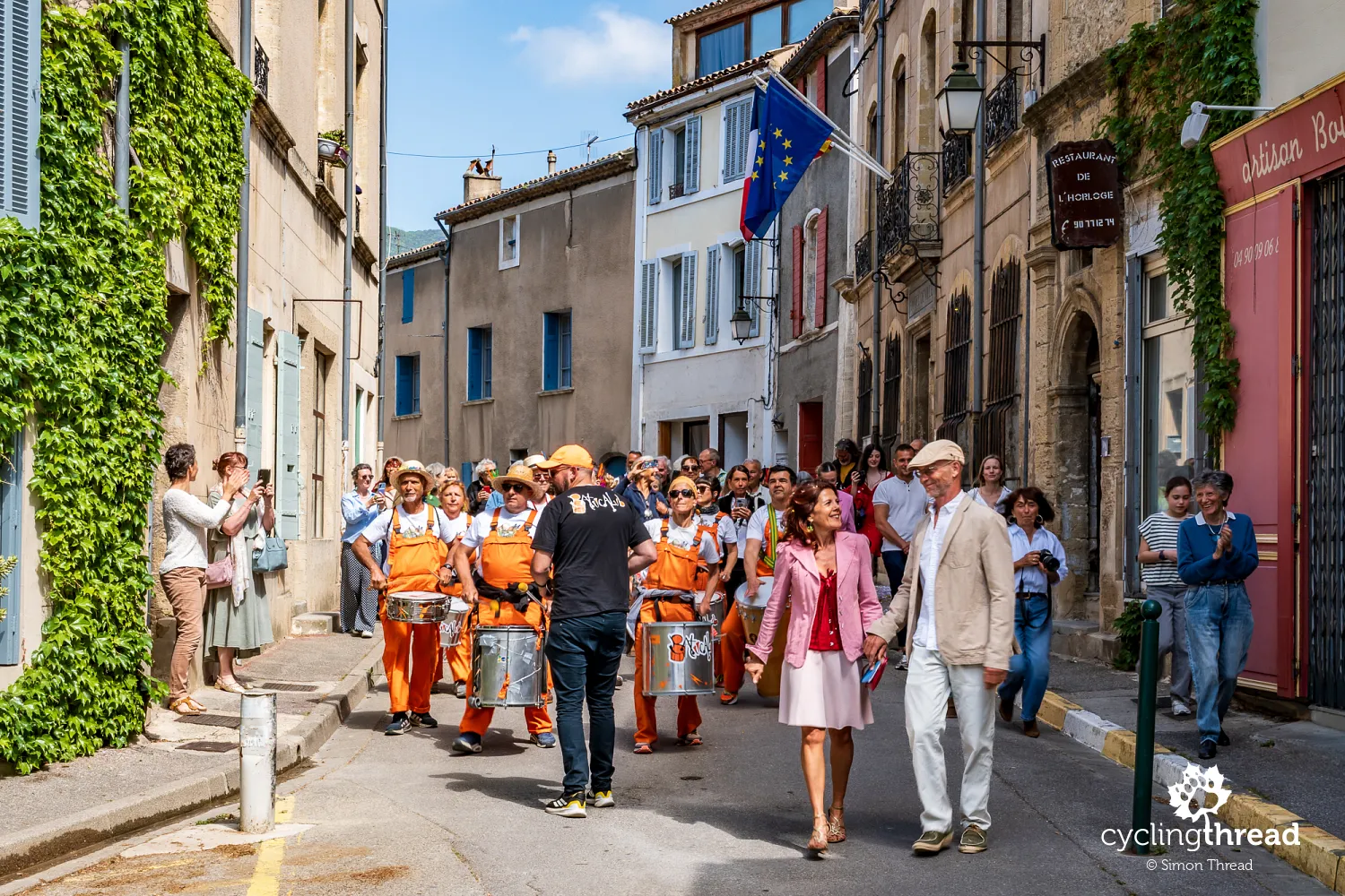 A wedding procession through the streets of Cucuron